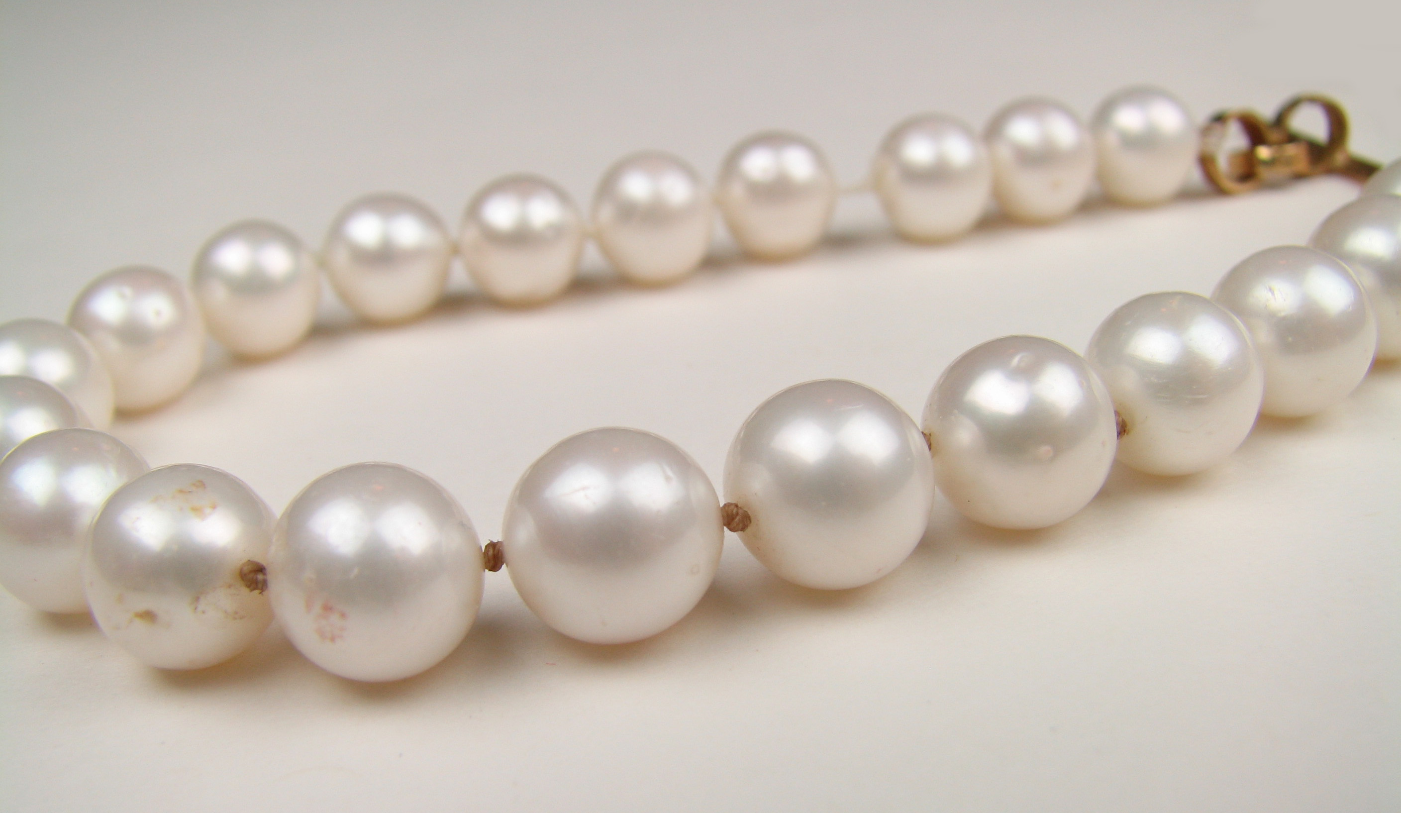 Pearls showing dirt